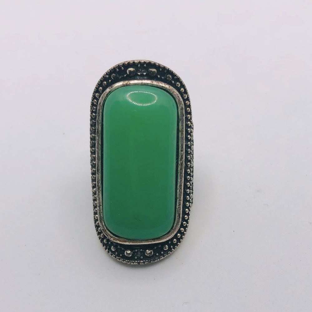 Long green dazzling ring